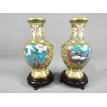 A pair of Chinese cloisonné baluster form vases,