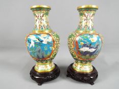 A pair of Chinese cloisonné baluster form vases,