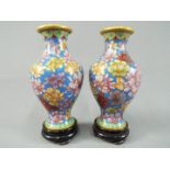A small pair of Chinese cloisonné vases decorated with chrysanthemum on a blue ground,
