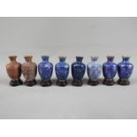 A 20 th century set of eight Chinese vases of baluster form showing the stages of producing a