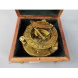 A boxed brass sundial compass marked J. H. Steward Ltd.