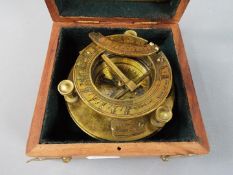 A boxed brass sundial compass marked J. H. Steward Ltd.