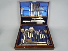 A canteen of cutlery, with contents.