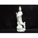 A 19th or 20th century Chinese Dehua porcelain (blanc de chine) figurine depicting Guanyin standing