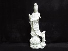 A 19th or 20th century Chinese Dehua porcelain (blanc de chine) figurine depicting Guanyin standing