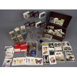 A mixed lot to include cigarette cards, Acme 'Siren', small quantity of coins,