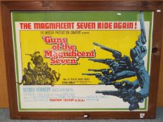 A framed movie poster 'Guns of the Magnificent Seven', approximately 74.5 cm x 101 cm image size.