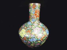 A very large Chinese millefleur bottle vase with chrysanthemums and peonies,