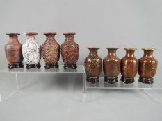 A 20 th century set of eight Chinese vases of baluster form showing the stages of producing a