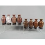 A 20 th century set of eight Chinese vases of baluster form showing the stages of producing a