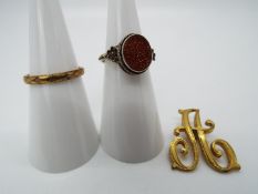 Goldstone - a white metal ring set with flat oval Goldstone, measuring 1 cm x 0.