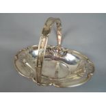An Edward VII silver hallmarked fruit bowl with swing handle by Mappin Brothers,