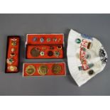 A collection of commemorative Soviet Russian badges and similar.