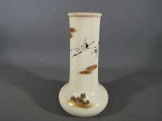 A Meiji period Satsuma vase of unusual bottle form having a broad neck above a compressed lower