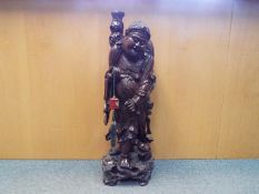 A large carved wood Buddha,