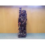 A large carved wood Buddha,