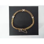 925 Silver - a double stranded rope bracelet with a three X stone set design,