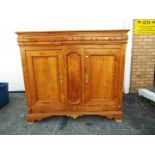 A large sideboard having three drawers over twin cupboard doors,