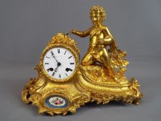 A good, floral and rococo-styled ormolu French mantel clock,