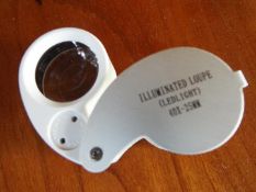 A Jeweller's Loupe, 40 x magnification with internal LED illumination,