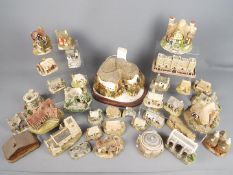 A collection of Lilliput Lane and similar model cottages and buildings including Britain's