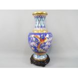 A large Chinese cloisonné vase decorated to the body with birds,