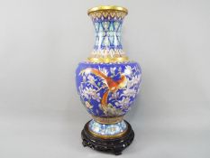 A large Chinese cloisonné vase decorated to the body with birds,