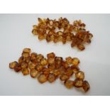 An amber bead necklace, in need of re-stringing, approximately 12 mm x 10 mm typical bead size,