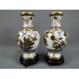 A pair of Chinese cloisonné baluster vases with elongated neck,