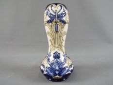 Moorcroft - A Moorcroft Pottery limited edition 'Frog' vase, approximately 24 cm (h).