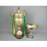 Two vintage, white metal, amateur rugby league trophies, The Noel Tatlock Trophy and the N.W.C.A.R.