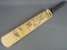 A Slazenger V1200 Autograph cricket bat bearing signatures of the Indian and England Teams