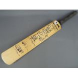 A Slazenger V1200 Autograph cricket bat bearing signatures of the Indian and England Teams