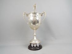 Rugby League - a large Silver twin handled Trophy with repousse decoration,