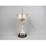 Rugby League - a large Silver twin handled Trophy with repousse decoration,