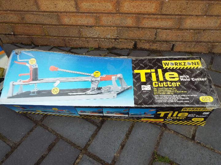 A Workzone tile cutter contained in original box and a Powercraft 720 Portable Generator, boxed. - Image 2 of 3