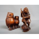 Two carved wood netsuke, the first depicting two owls, the other depicting a rice farmer,