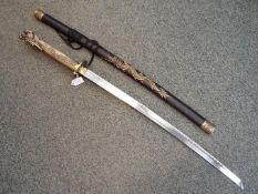 A reproduction Katana with dragon decorated tsuka and tsuba, 66.5 cm blade length.