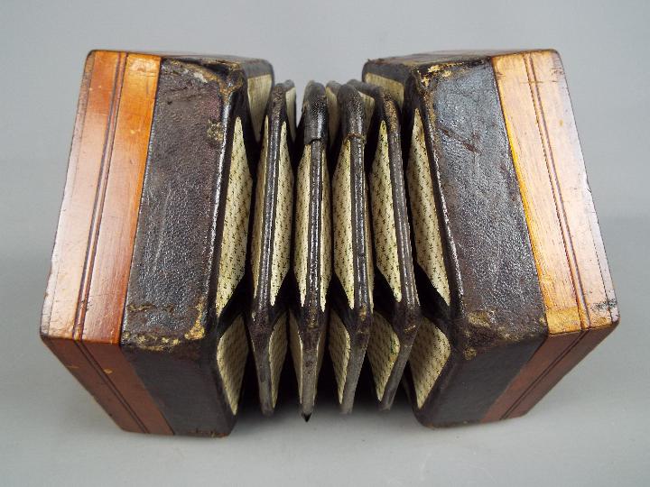 A Lachenal & Co 48 button concertina with hexagonal fretworked ends, - Image 3 of 5