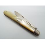 A Victorian silver and mother of pearl folding fruit knife, vacant cartouche to the handle,