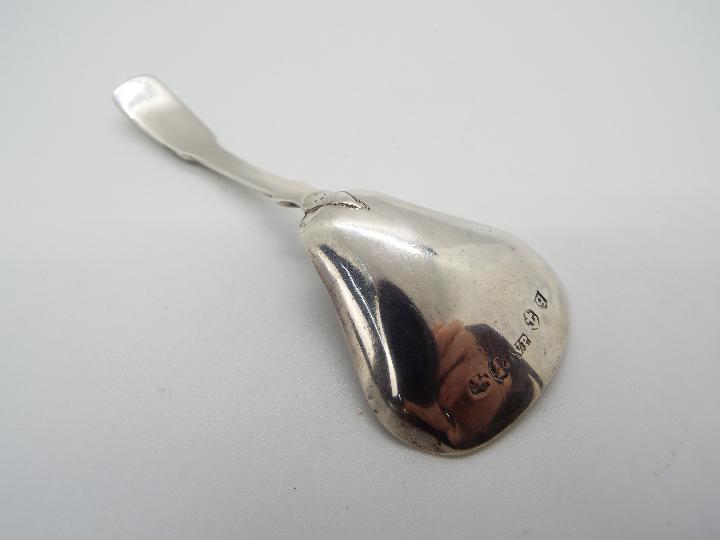 A George III hallmarked silver caddy spoon, Birmingham assay 1814, makers mark for William Pugh, - Image 2 of 3