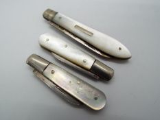 Three George V silver and mother of pearl folding fruit knives, all Sheffield assay,