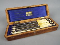 A set of four Joseph Rodgers & Sons cut throat razors contained in silk lined case.