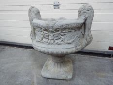 Garden Stoneware - A large reconstituted stone two handled decorative urn planter in two pieces