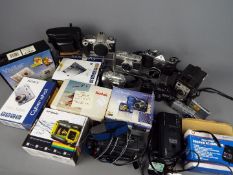 Photography - A collection of cameras and photographic equipment to include Konica, Canon, Pentax,
