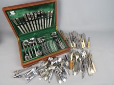 A canteen of Viners stainless steel cutlery and a quantity of loose cutlery, plated and stainless.