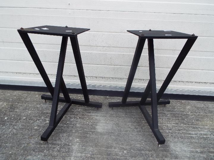 A pair of large speaker stands.