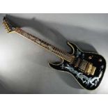 An Indie Dragon electric guitar finished in black with mother-of-pearl inlays, with soft carry case.