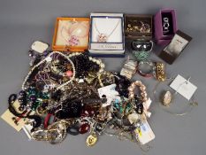 A large quantity of costume jewellery including necklaces, bracelets, earrings and similar.