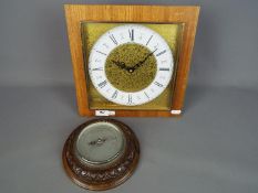 A Kienzle automatic wall clock and barometer.